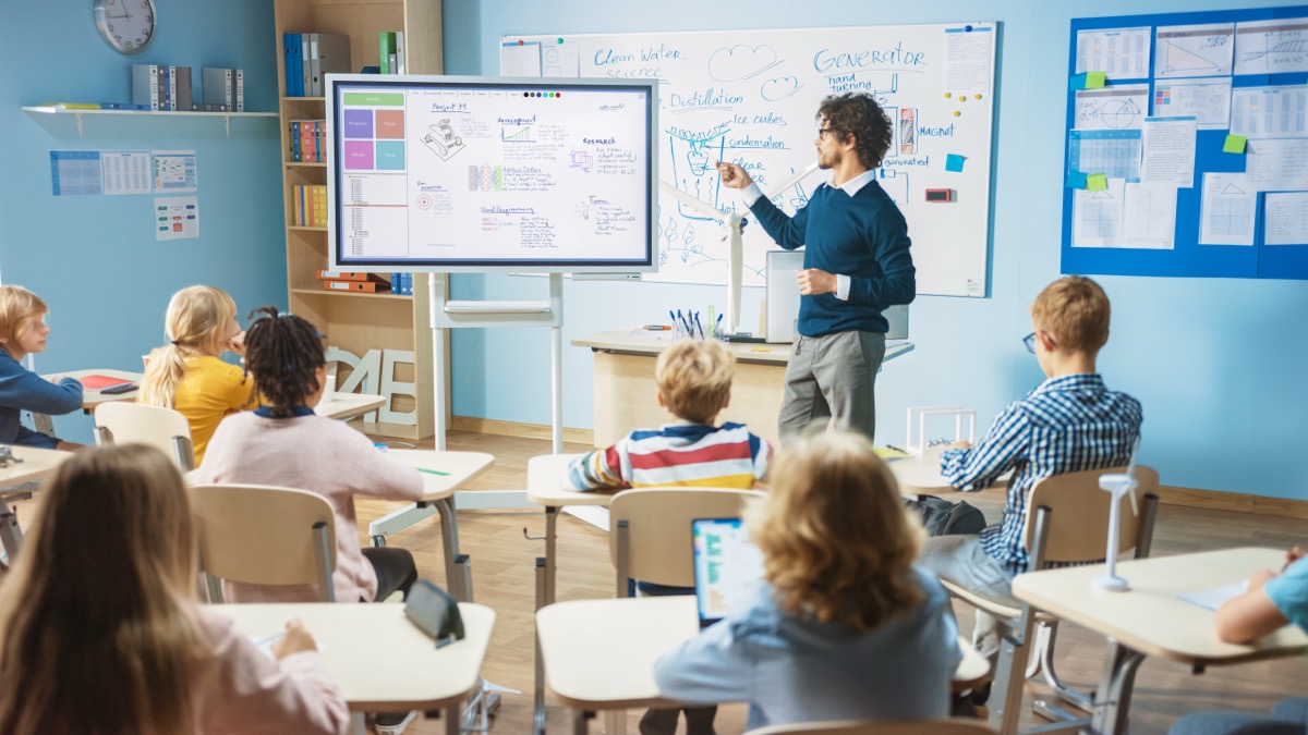 Teacher engaging students in modern classroom