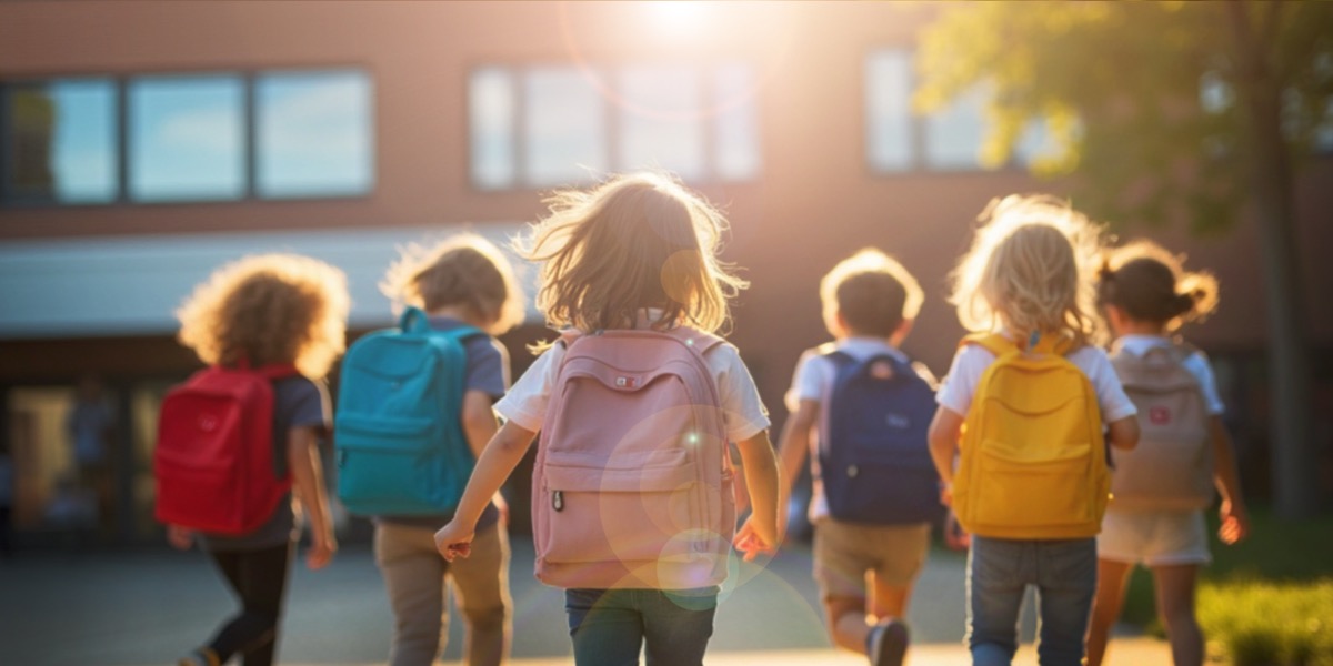 Children with backpacks walking to school